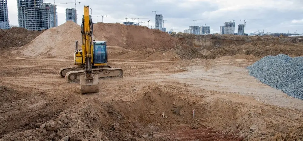 Excavator clearing a construction site