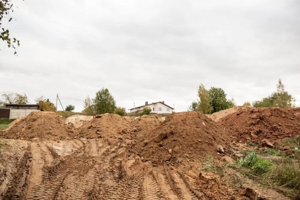 Cleared ground and graded soil after a site clearance
